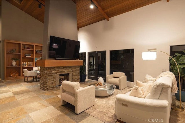 living room with high vaulted ceiling, beam ceiling, wood ceiling, and a fireplace