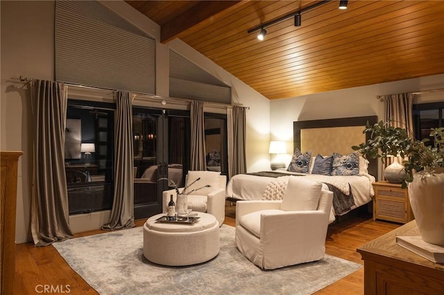 bedroom featuring beamed ceiling, hardwood / wood-style flooring, wood ceiling, high vaulted ceiling, and rail lighting