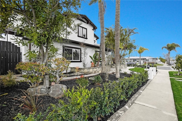 exterior space with fence and stucco siding