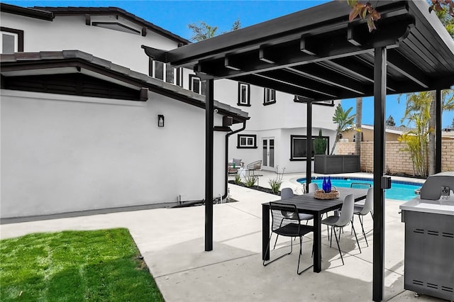 view of patio with fence and a fenced in pool