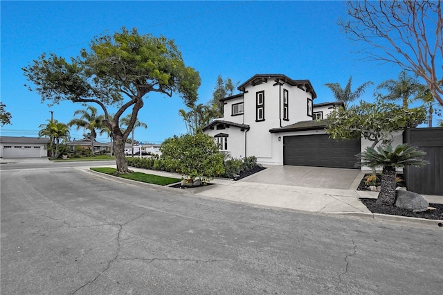 view of front of property with driveway and stucco siding