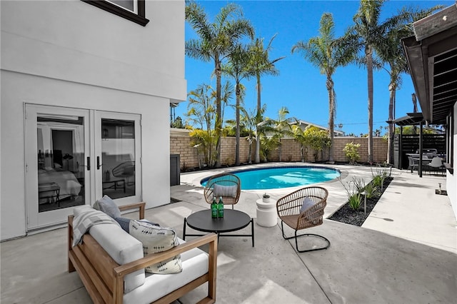 view of pool featuring a patio area, a fenced backyard, and a fenced in pool