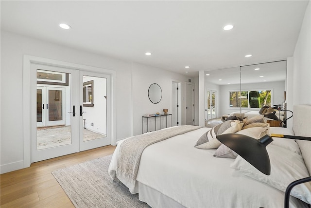 bedroom with access to exterior, recessed lighting, light wood-style floors, and french doors