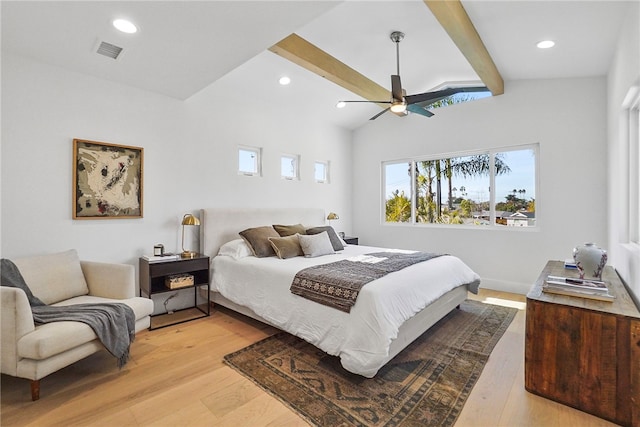 bedroom featuring light wood-type flooring, visible vents, vaulted ceiling with beams, and recessed lighting