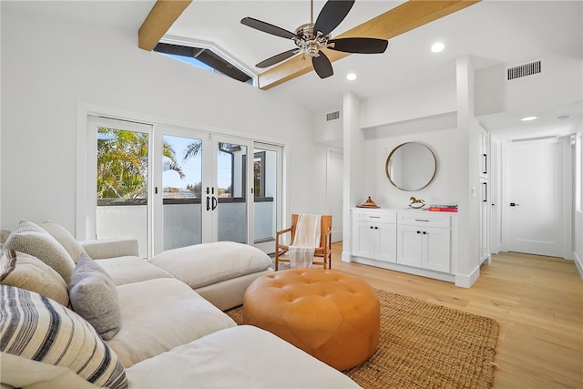 living room with light wood-style floors, french doors, visible vents, and vaulted ceiling with beams