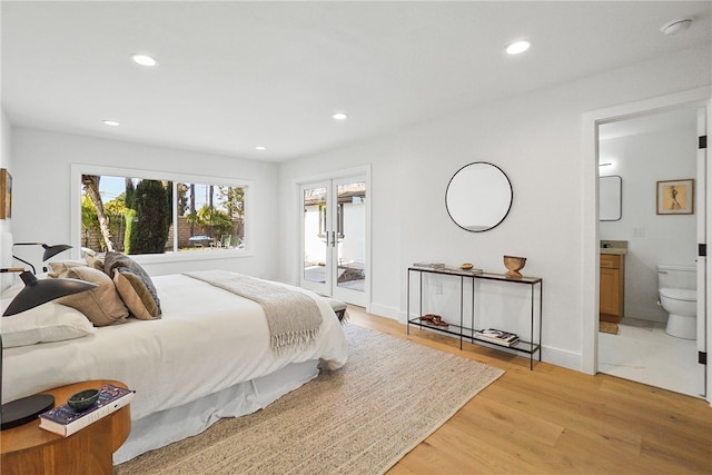 bedroom with french doors, light wood finished floors, recessed lighting, ensuite bathroom, and baseboards