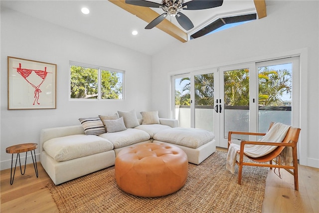 sitting room featuring french doors, lofted ceiling, recessed lighting, a ceiling fan, and light wood-type flooring