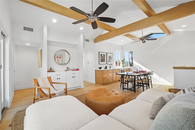 living room featuring recessed lighting, visible vents, ceiling fan, light wood-type flooring, and beamed ceiling