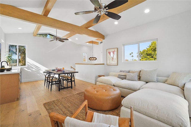 living room with lofted ceiling with beams, ceiling fan, light wood-style flooring, recessed lighting, and baseboards