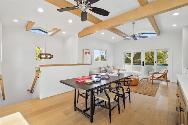 dining area with baseboards, vaulted ceiling with beams, and light wood finished floors