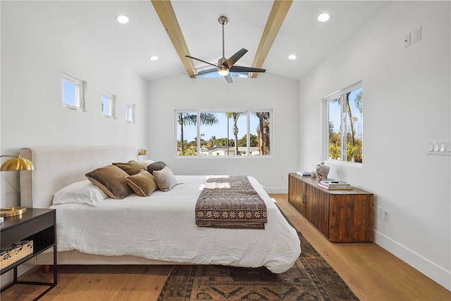 bedroom featuring lofted ceiling with beams, baseboards, wood finished floors, and recessed lighting