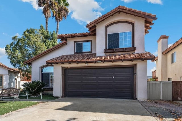 mediterranean / spanish house with a garage