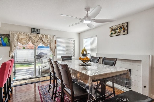 dining area featuring ceiling fan and wood-type flooring