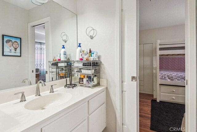 bathroom with vanity and hardwood / wood-style floors