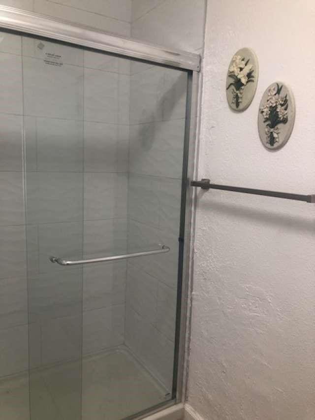 bathroom featuring walk in shower