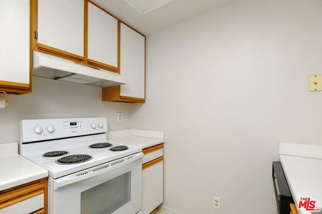 kitchen with white cabinetry and white range with electric cooktop