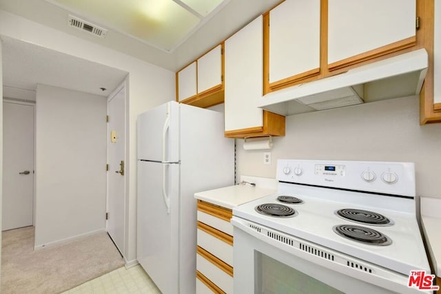 kitchen with white cabinets and white appliances