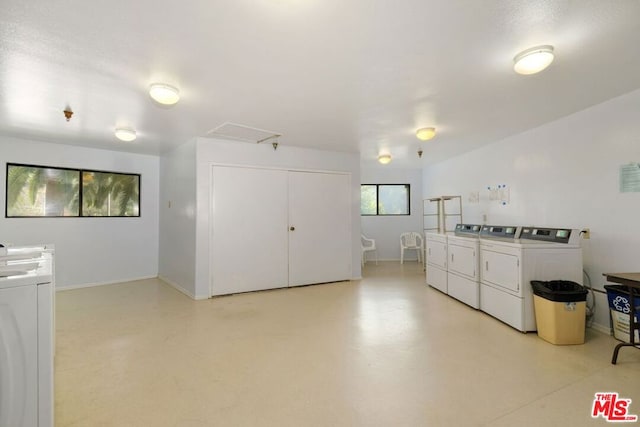 clothes washing area featuring washer and clothes dryer