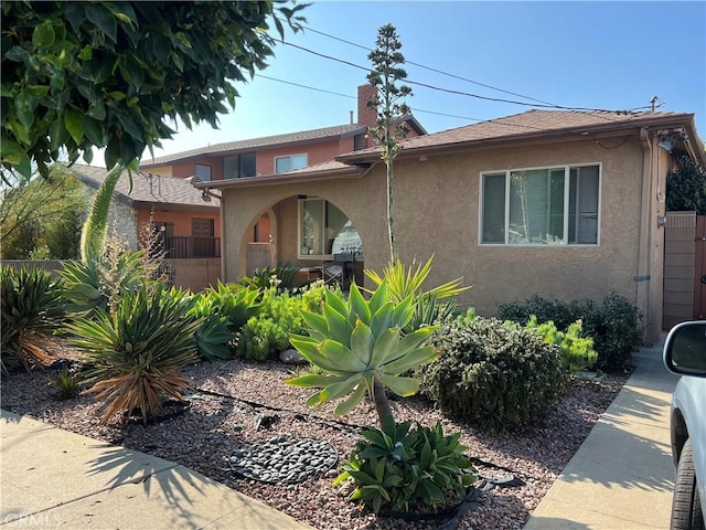 1547 Island Ave, Wilmington, CA 90744 - view of front of property featuring stucco siding and a chimney