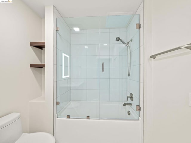 bathroom with toilet and enclosed tub / shower combo