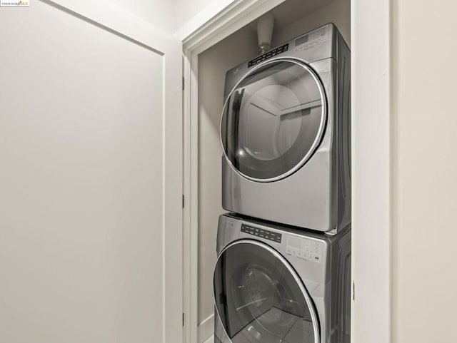 laundry room with stacked washer and clothes dryer