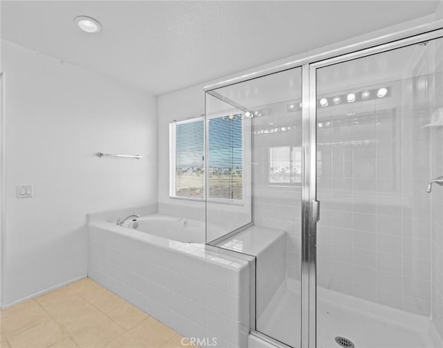 bathroom with shower with separate bathtub and tile patterned floors