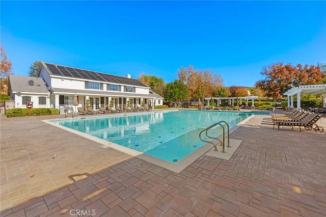 view of swimming pool featuring a patio area