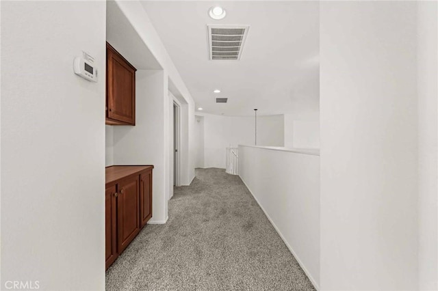 hallway with light carpet