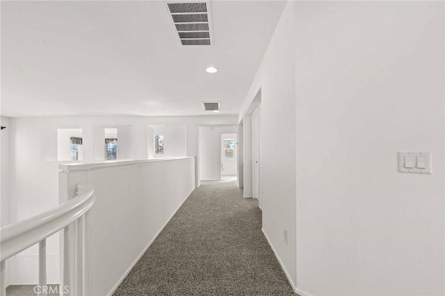 hallway with carpet floors