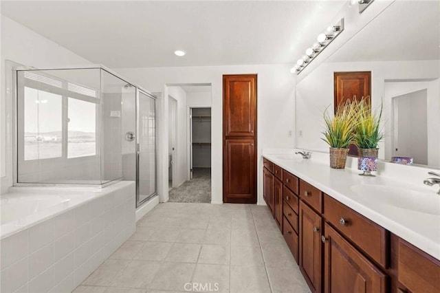 bathroom with tile patterned floors, vanity, and plus walk in shower