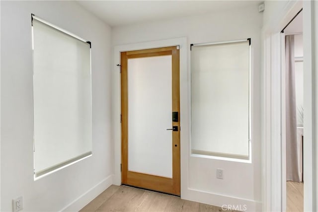 doorway to outside featuring light hardwood / wood-style floors