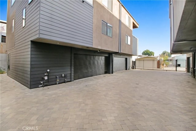 view of property exterior featuring a garage