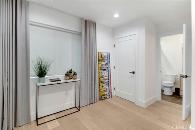 corridor featuring light hardwood / wood-style flooring