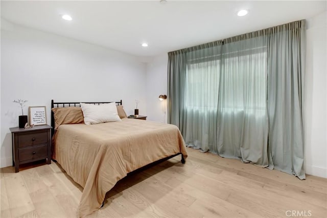 bedroom with light hardwood / wood-style floors