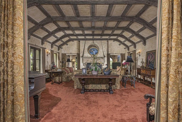 unfurnished living room with lofted ceiling with beams and carpet floors