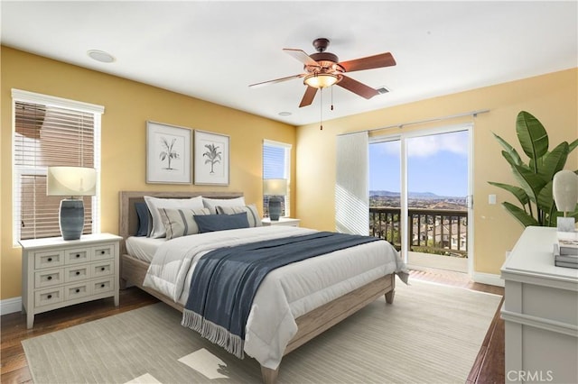 bedroom featuring access to exterior, ceiling fan, and light hardwood / wood-style flooring