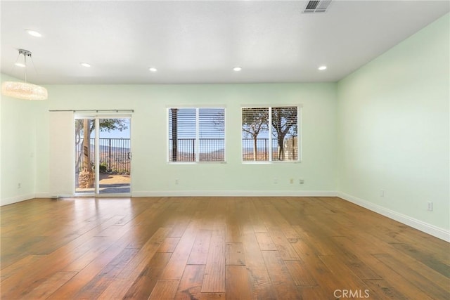 unfurnished room featuring wood-type flooring