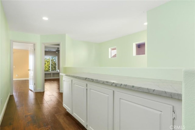 hall with dark wood-type flooring