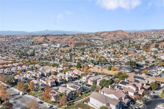 birds eye view of property with a mountain view