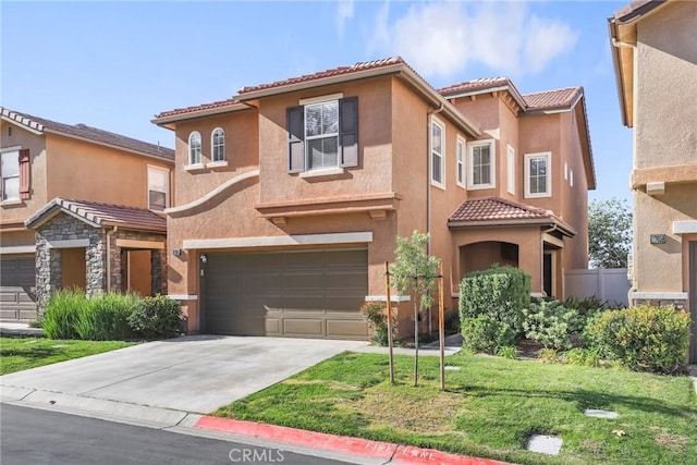 mediterranean / spanish-style house with a garage and a front yard