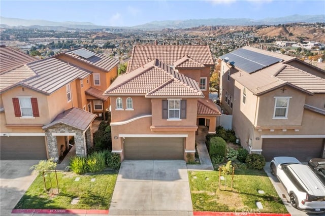 view of front of home featuring a mountain view and a garage