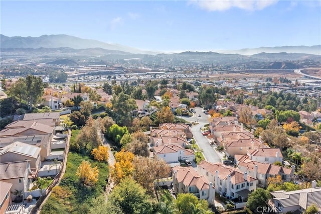 birds eye view of property with a mountain view