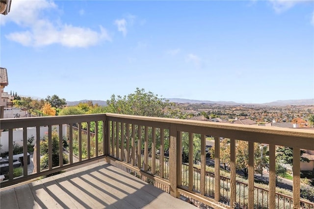 wooden deck with a mountain view