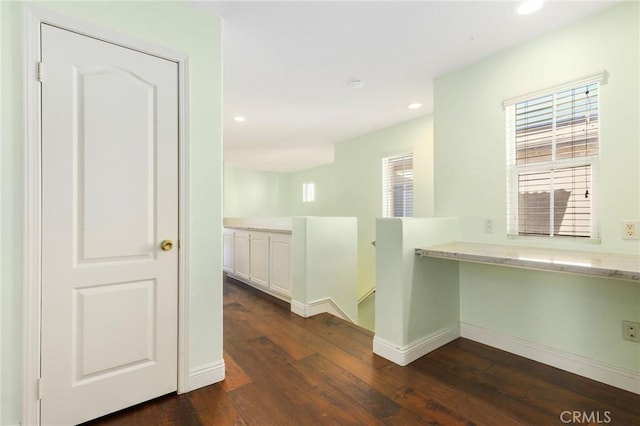 hallway featuring dark hardwood / wood-style floors