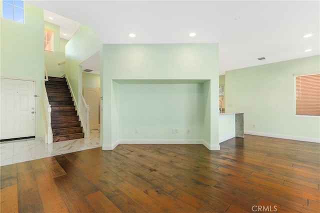 unfurnished living room with hardwood / wood-style flooring