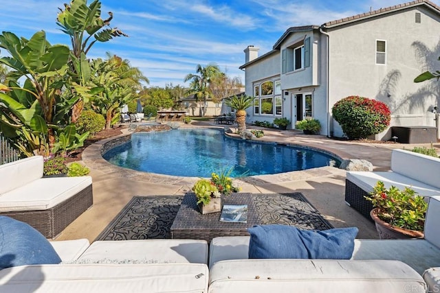 outdoor pool featuring outdoor lounge area and a patio