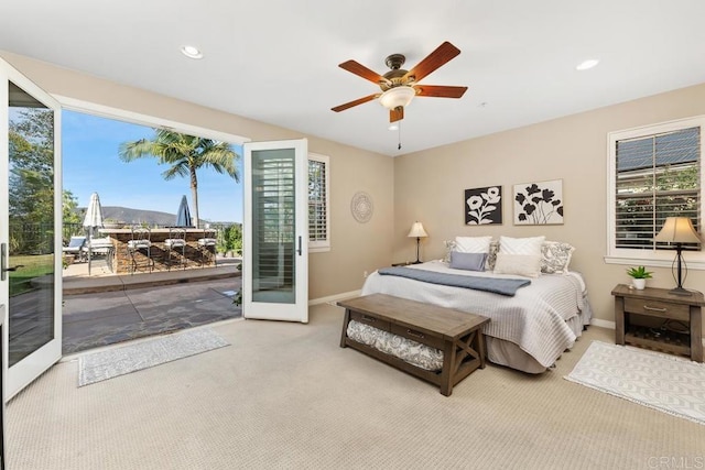 bedroom with baseboards, ceiling fan, carpet, access to outside, and french doors