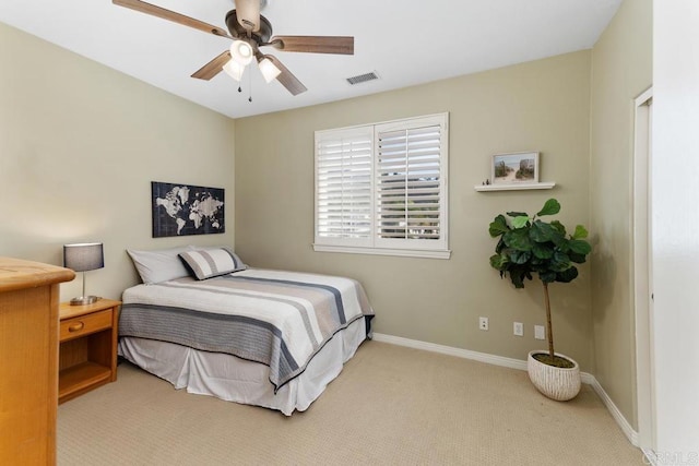 bedroom with light colored carpet, visible vents, ceiling fan, and baseboards