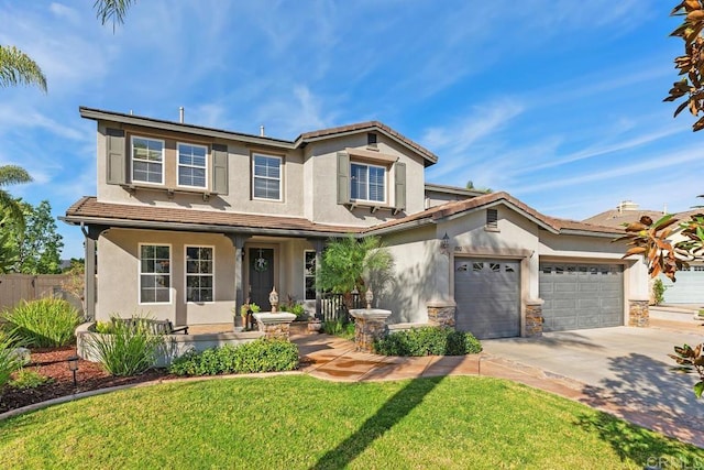 view of front of house featuring stucco siding, a front yard, a garage, stone siding, and driveway