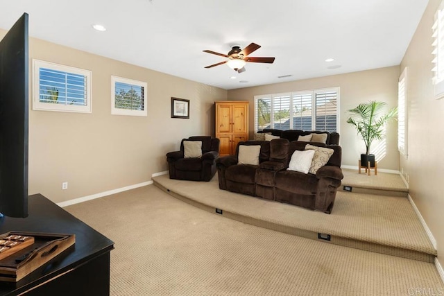 carpeted living room featuring a ceiling fan, recessed lighting, and baseboards